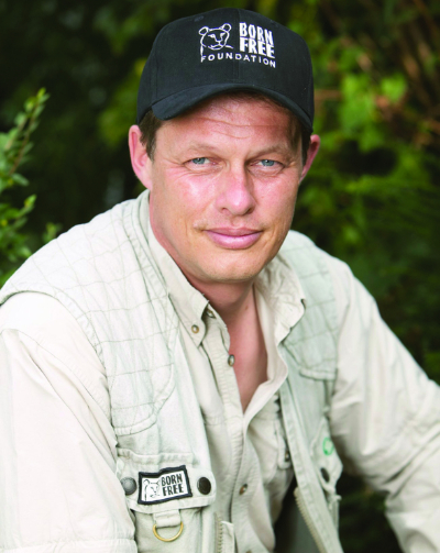 Portrait image of Will Travers in baseball cap
